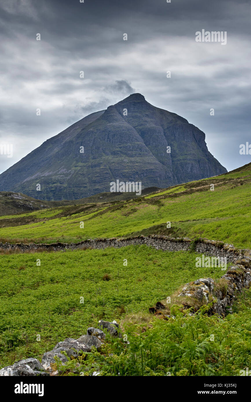 Old dry stone wall in front of mountain top Sàil Gharb, one Quinag's three separate Corbett summits in the Scottish Highlands, Sutherland, Scotland Stock Photo