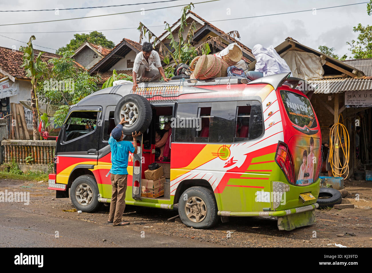 Minibus from Labuan to Tamanyaya being loaded, public transport in Java, Indonesia Stock Photo