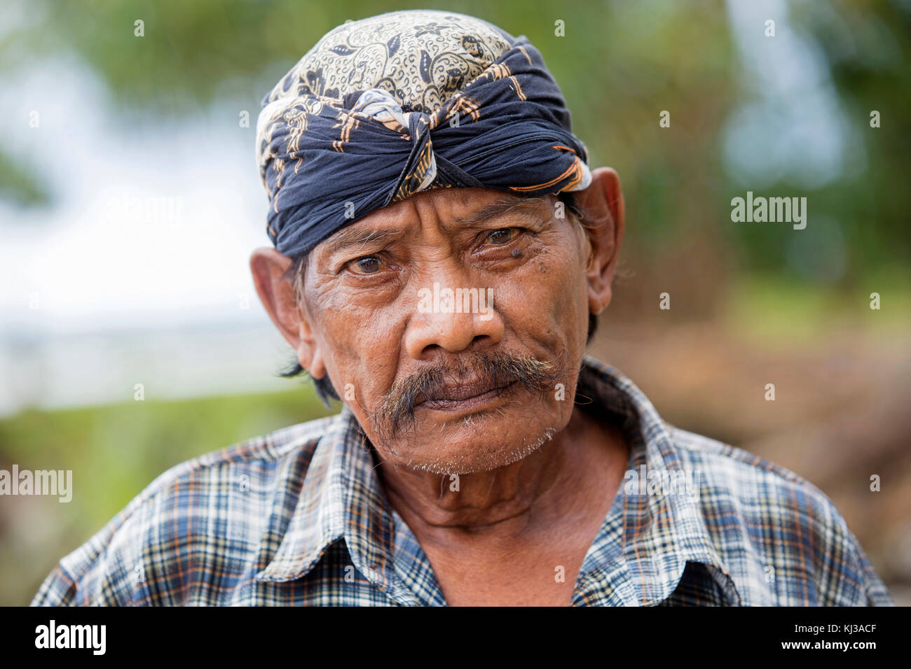 Close up portrait of Javanese man wearing udeng / udheng in Tamanyaya, western Java, Indonesia Stock Photo