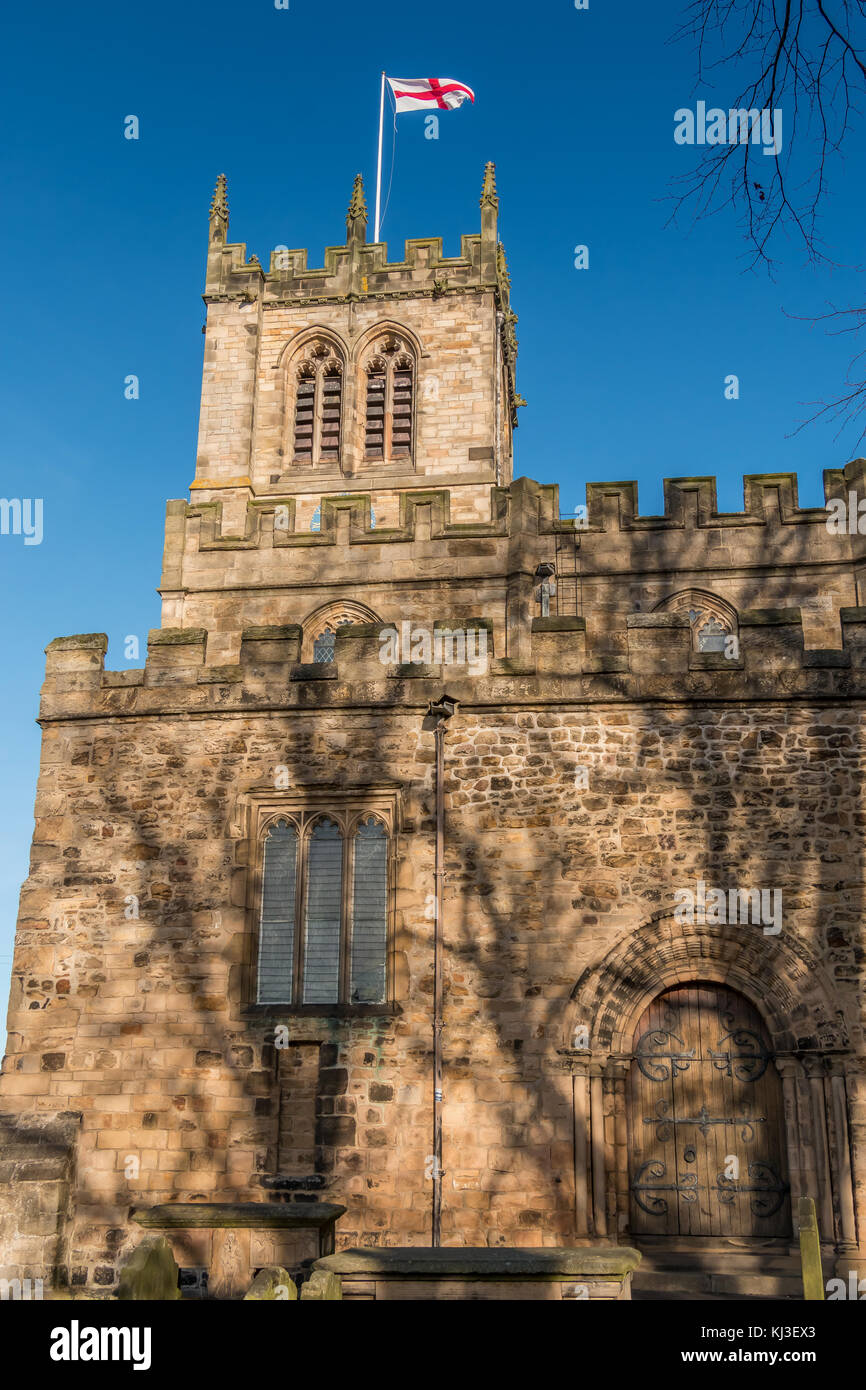 The tower of St Mary's Parish Church, Barnard Castle, North East England, UK in bright late autumn sunshine under a clear blue sky Stock Photo
