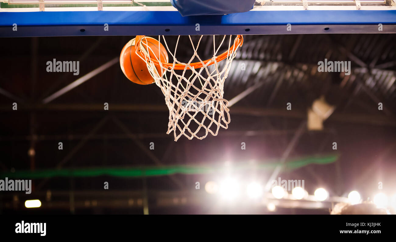scoring during a basketball game ball in hoop Stock Photo Alamy