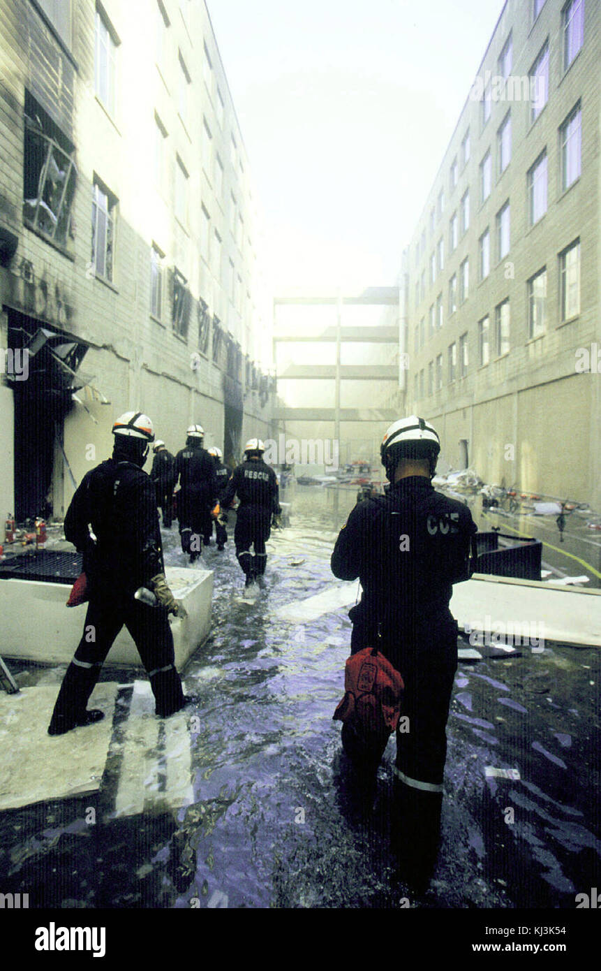Technical rescue engineers make their way through the wreckage between the rings inside the Pentagon in the aftermath of September 11th terrorist attack Stock Photo