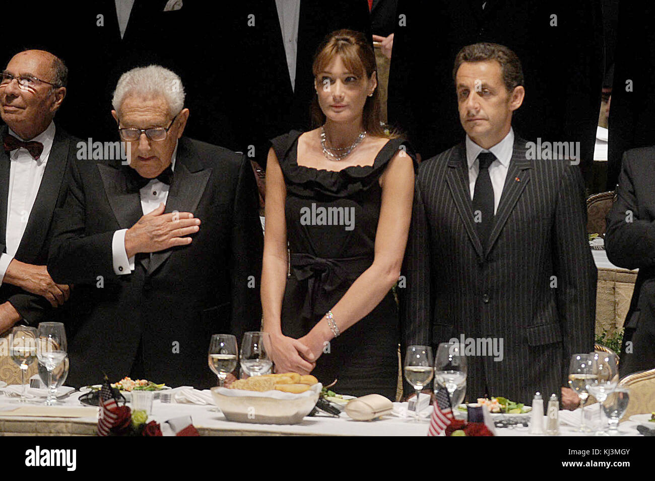 NEW YORK - SEPTEMBER 23: French President Nicolas Sarkozy, wife Carla Bruni Sarkozy and former Secretary of State Henry Kissinger attend the 2008 Appeal of Conscience Foundation awards dinner at the Waldorf-Astoria hotel September 23, 2008 in New York City. Sarkozy was presented with the Appeal of Conscience World Statesman Award for 'his leadership in advancing freedom, tolerance and inter-religious understanding  People:  Henry Kissinger, Nicolas Sarkozy, Carla Bruni Sarkozy Stock Photo