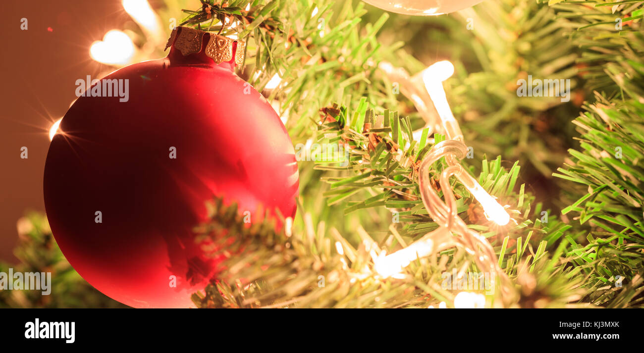 Red Christmas ball close up hanging on a Christmas tree Stock Photo - Alamy