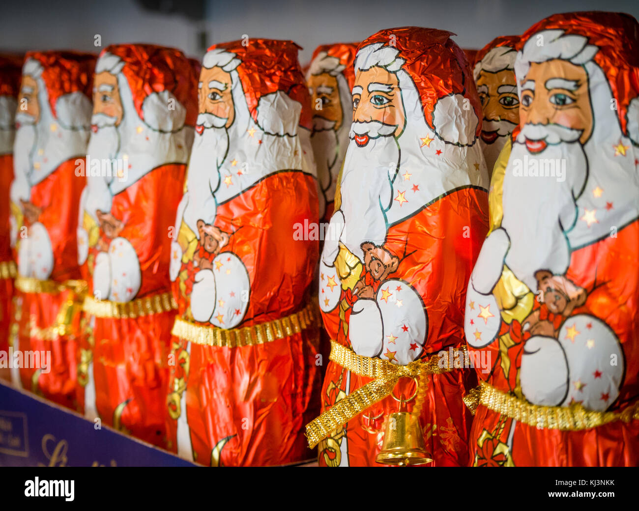 Zurich, Switzerland - 17 Nov 2017: Less than 6 weeks before Christmas, an army of chocolate Santa Clauses is lined up on a supermarket shelf. Stock Photo