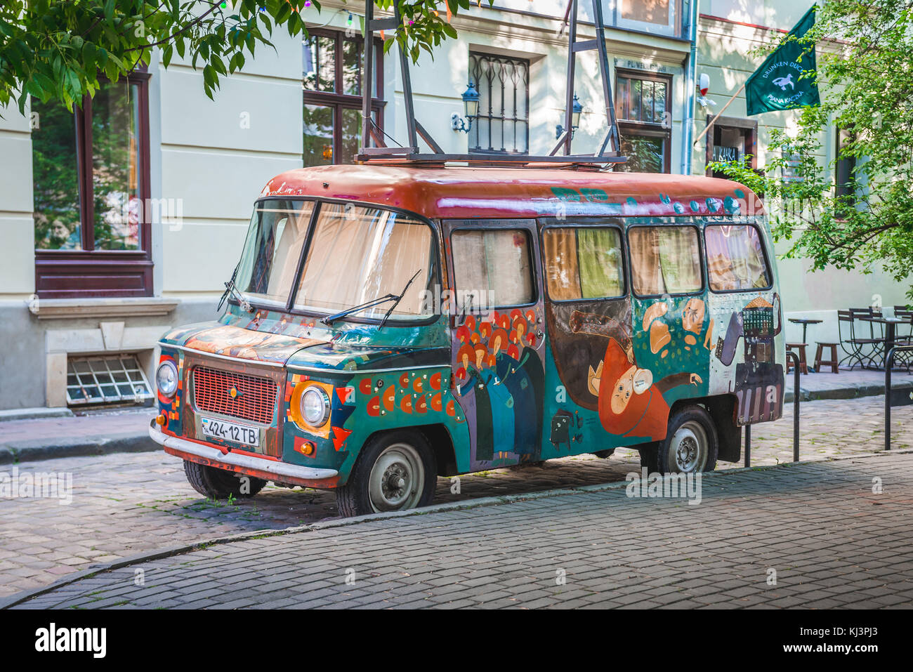 Painted Nysa van on the Old Town of Lviv city, largest city in western Ukraine Stock Photo