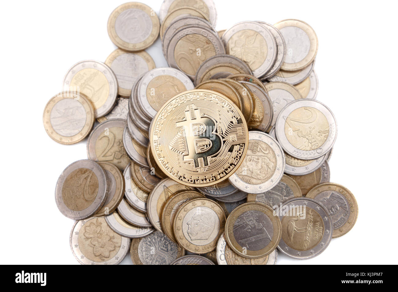 golden bitcoin on stack of euro coins Stock Photo - Alamy