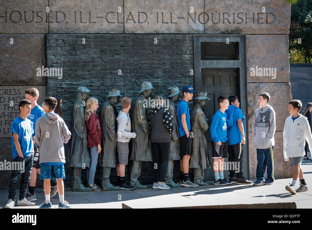 Young students posing, Bread Line, sculpture by George Segal, Room Two of Franklin Delano Roosevelt Memorial, Washington, D.C., United States of Ame Stock Photo