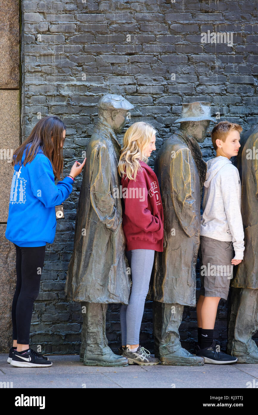 Young students posing, Bread Line, sculpture by George Segal, Room Two of Franklin Delano Roosevelt Memorial, Washington, D.C., USA Stock Photo