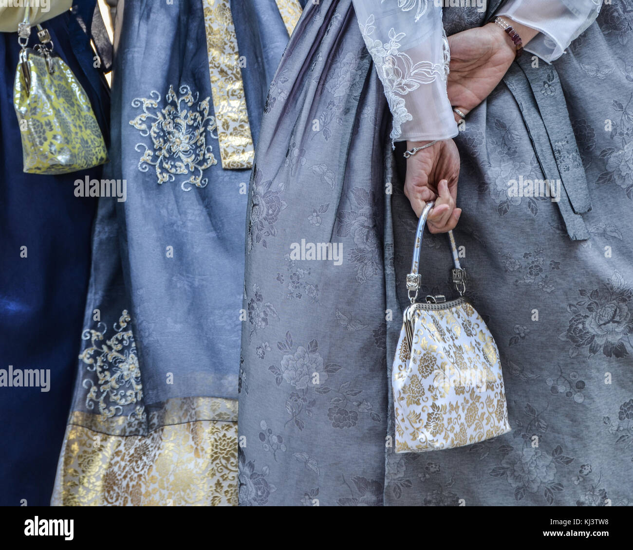 Closeup details of fabric and handbags of three girls traditional dress, Seoul, South Korea Stock Photo