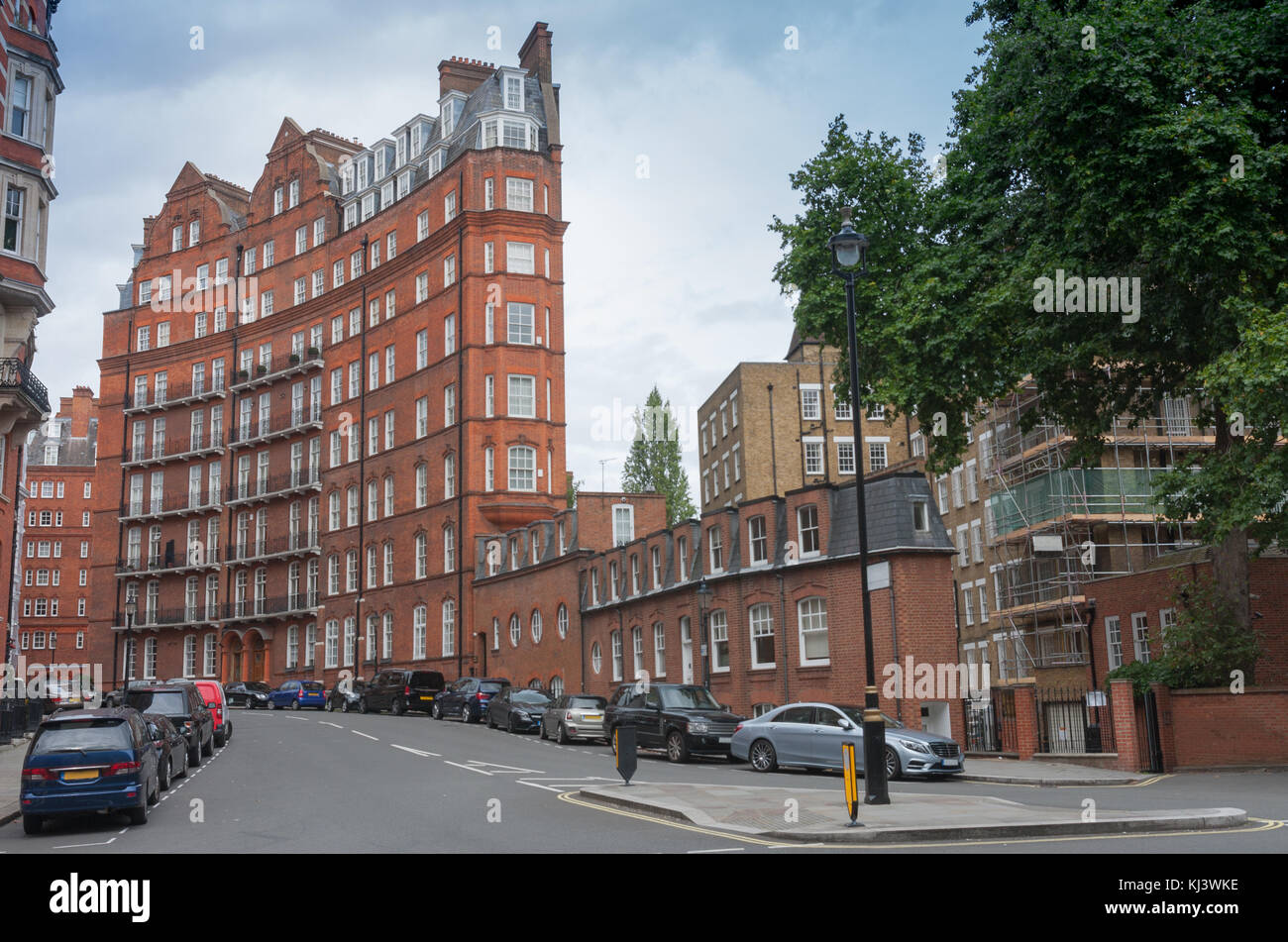 Curved building with red brick facade on Kensington Gore, London, England. Stock Photo