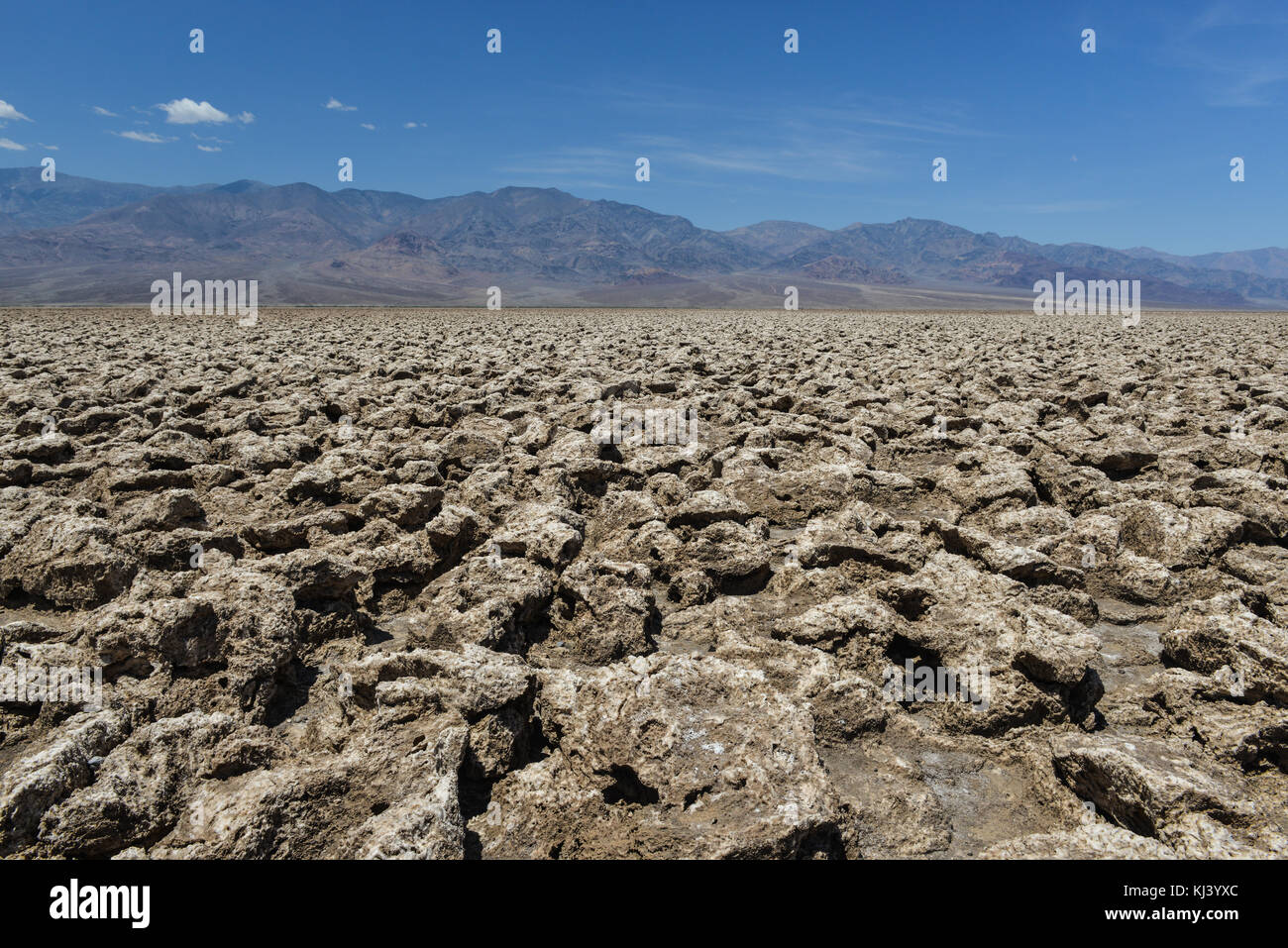 The rough ground and salt crystals which form the unusual geology of the Devil's Golf Course in Death Valley. Stock Photo