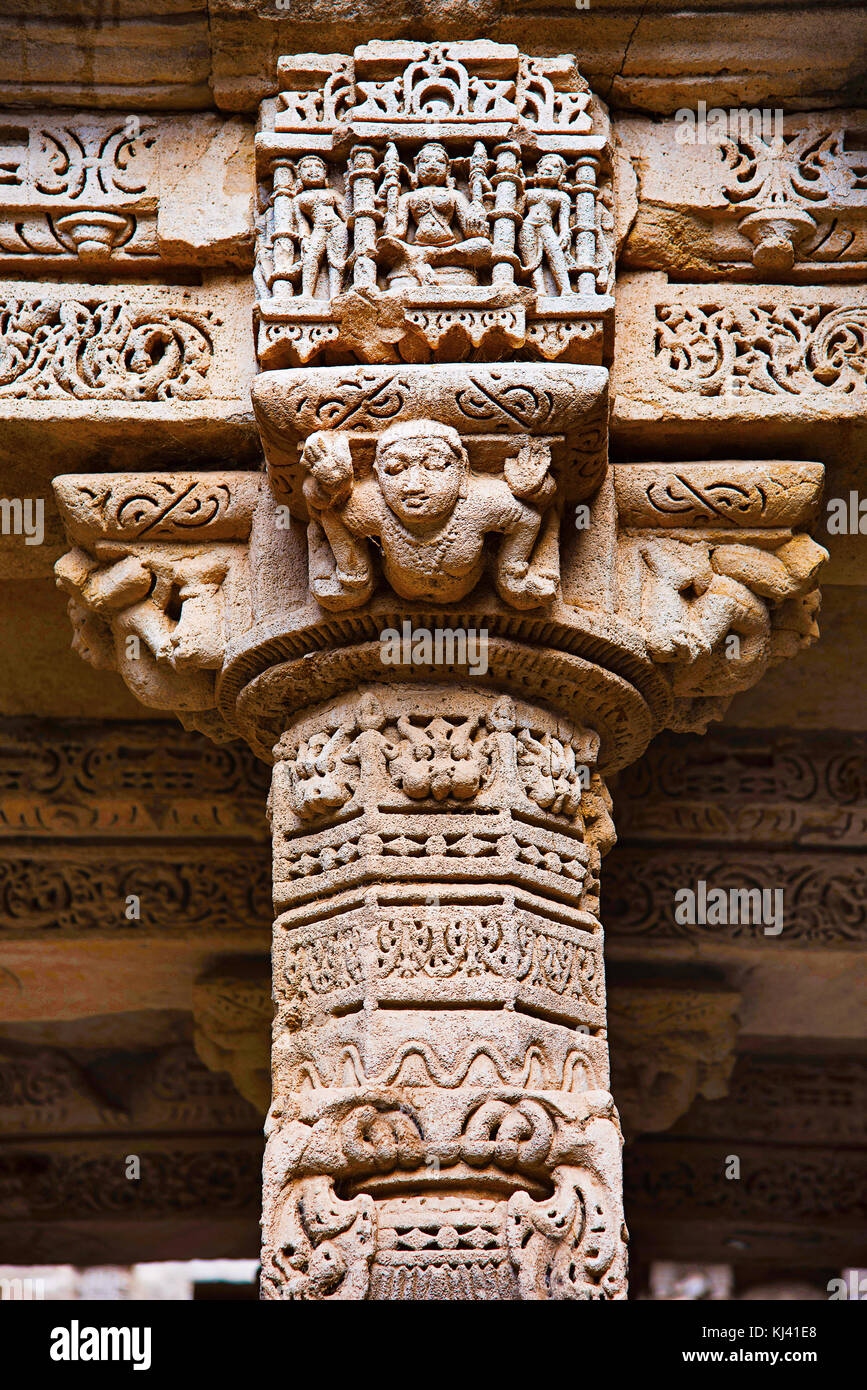 Carved idols on the inner wall and pillars of Rani ki vav,an intricately constructed step well. Patan in Gujarat, India. Stock Photo