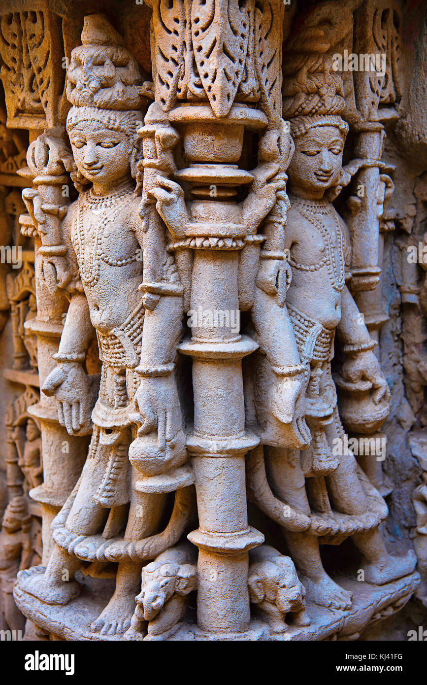 Carved idols on the inner wall and pillars of Rani ki vav, an intricately constructed step well. Patan in Gujarat, India. Stock Photo