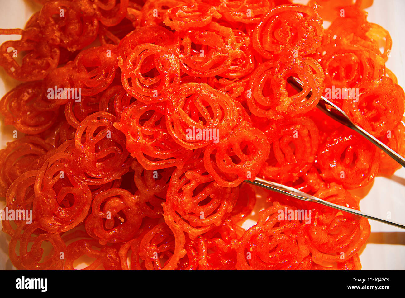 Closeup of Jalebi or zulbia sweet dish. Made by deepfrying maida