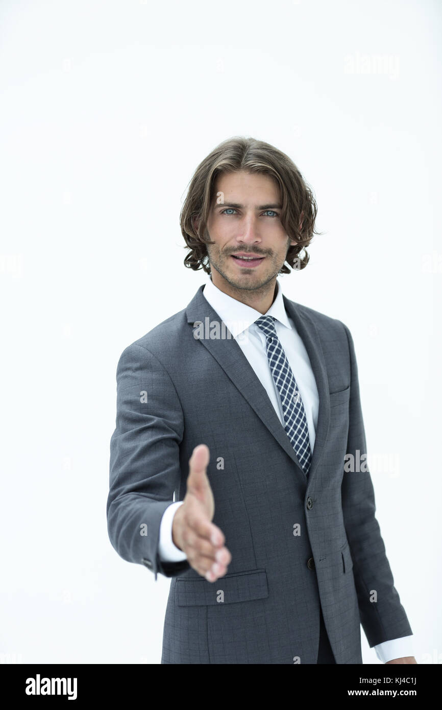 Smiling friendly businessman offers a handshake Stock Photo