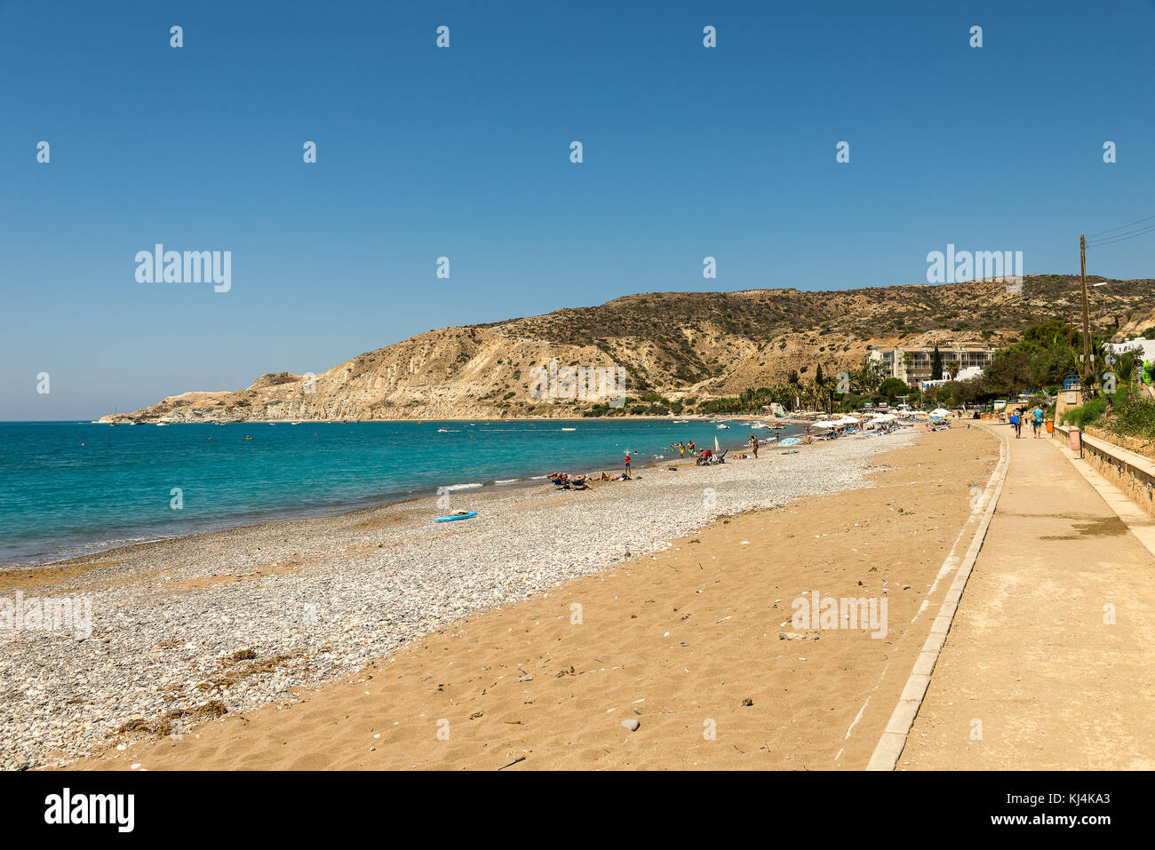 Pissouri Bay beach with tourists relaxing in a warm sunny day, between Limassol and Paphos, Cyprus Stock Photo