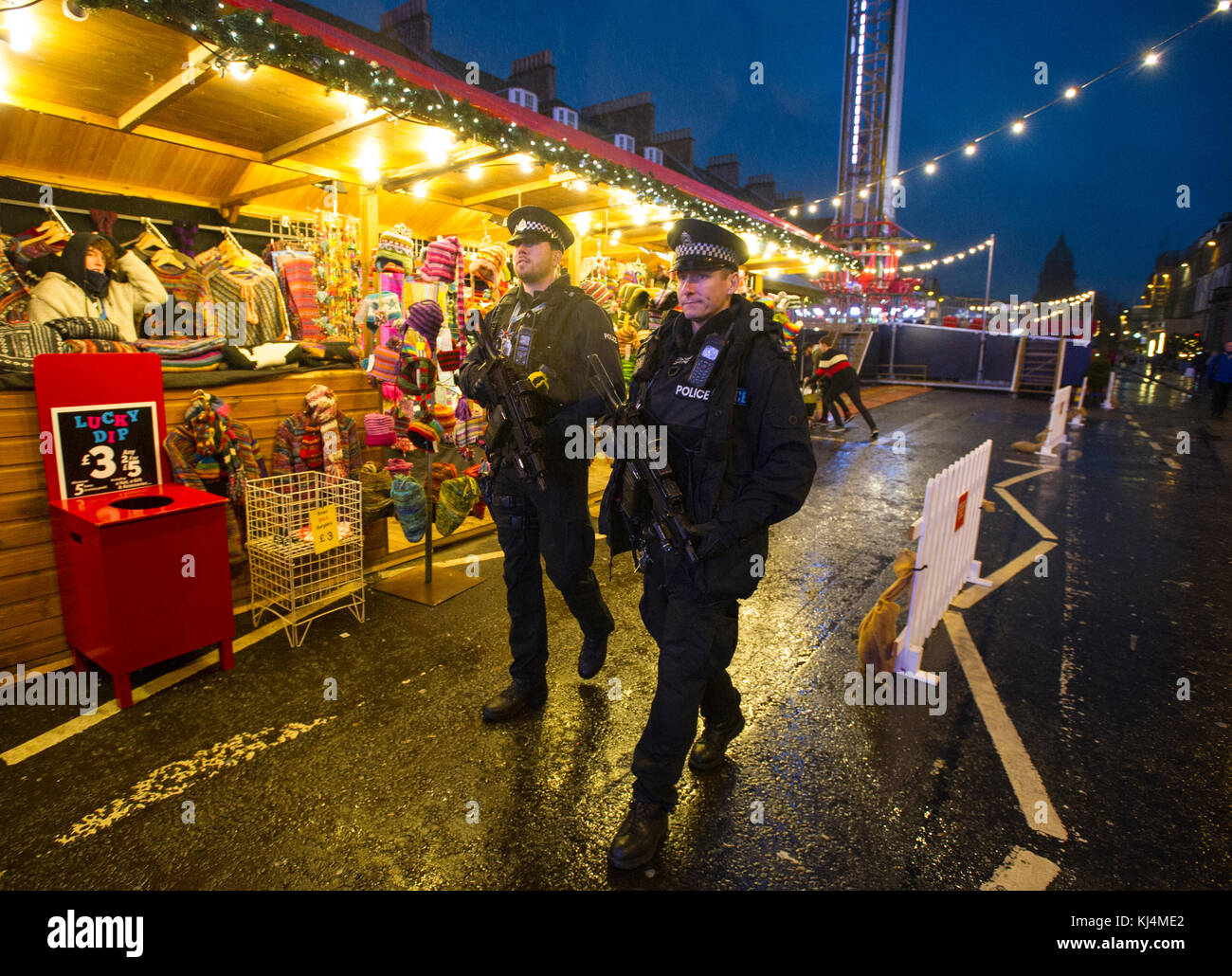Two armed police officers on patrol in George Street Edinburgh during the Christmas period. Stock Photo