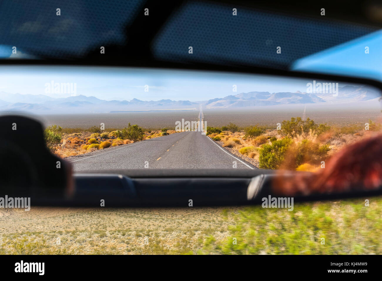 Rear mirror view on desert landscape, Nevada Stock Photo - Alamy