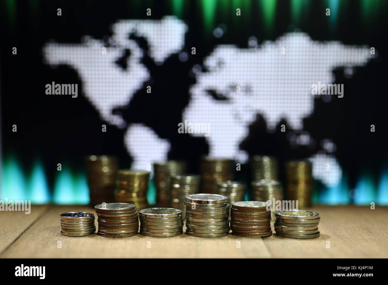 Digital economy. Coin stack graph shape with digital dots world map background. Business, finance and saving concept. Stock Photo