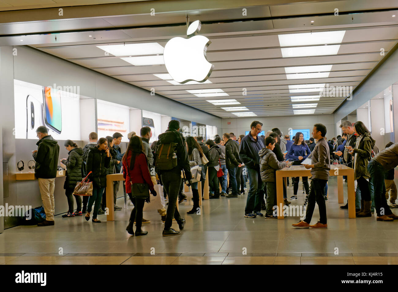 Salespeople and Customers at an Apple Store Looking at the Latest Apple  Products for Sale Editorial Stock Photo - Image of american, international:  203627338