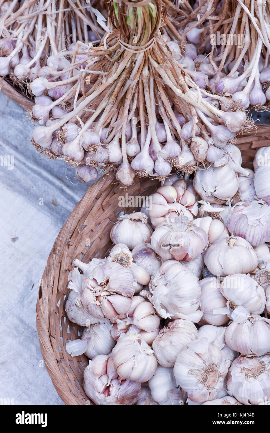 Dry garlic in baskets Stock Photo