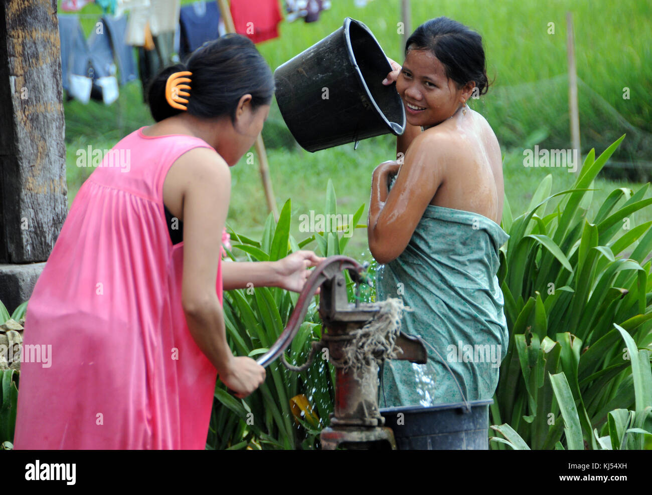 Young displaced woman in Mindanao cleaning up. This photo was taken in Datu  Piang municipality in Maguindanao province, Philippines, in May 2009 Stock  Photo - Alamy