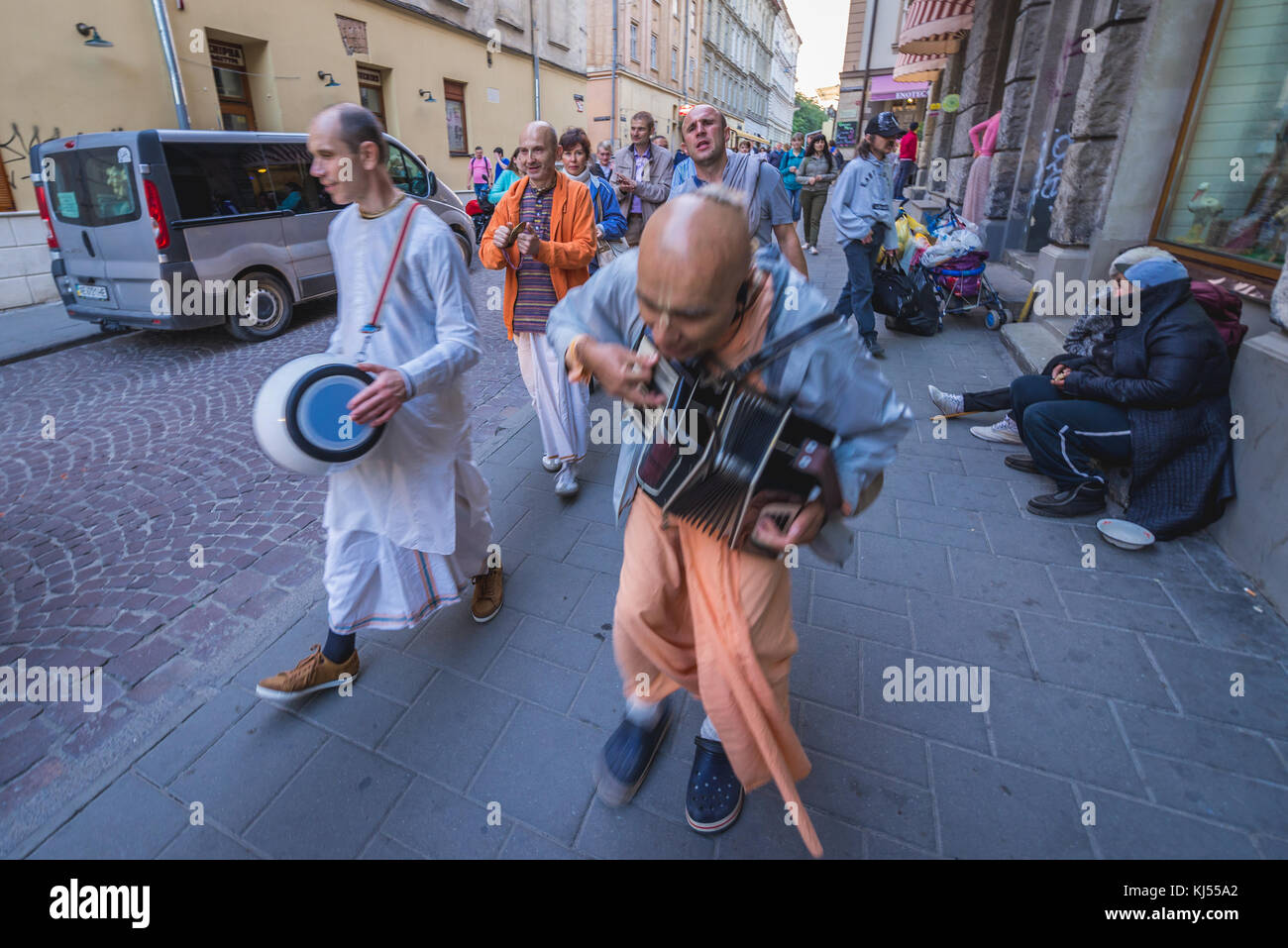 Members of Hare Krishna movement singing on the Old Town of Lviv city, largest city in western Ukraine Stock Photo