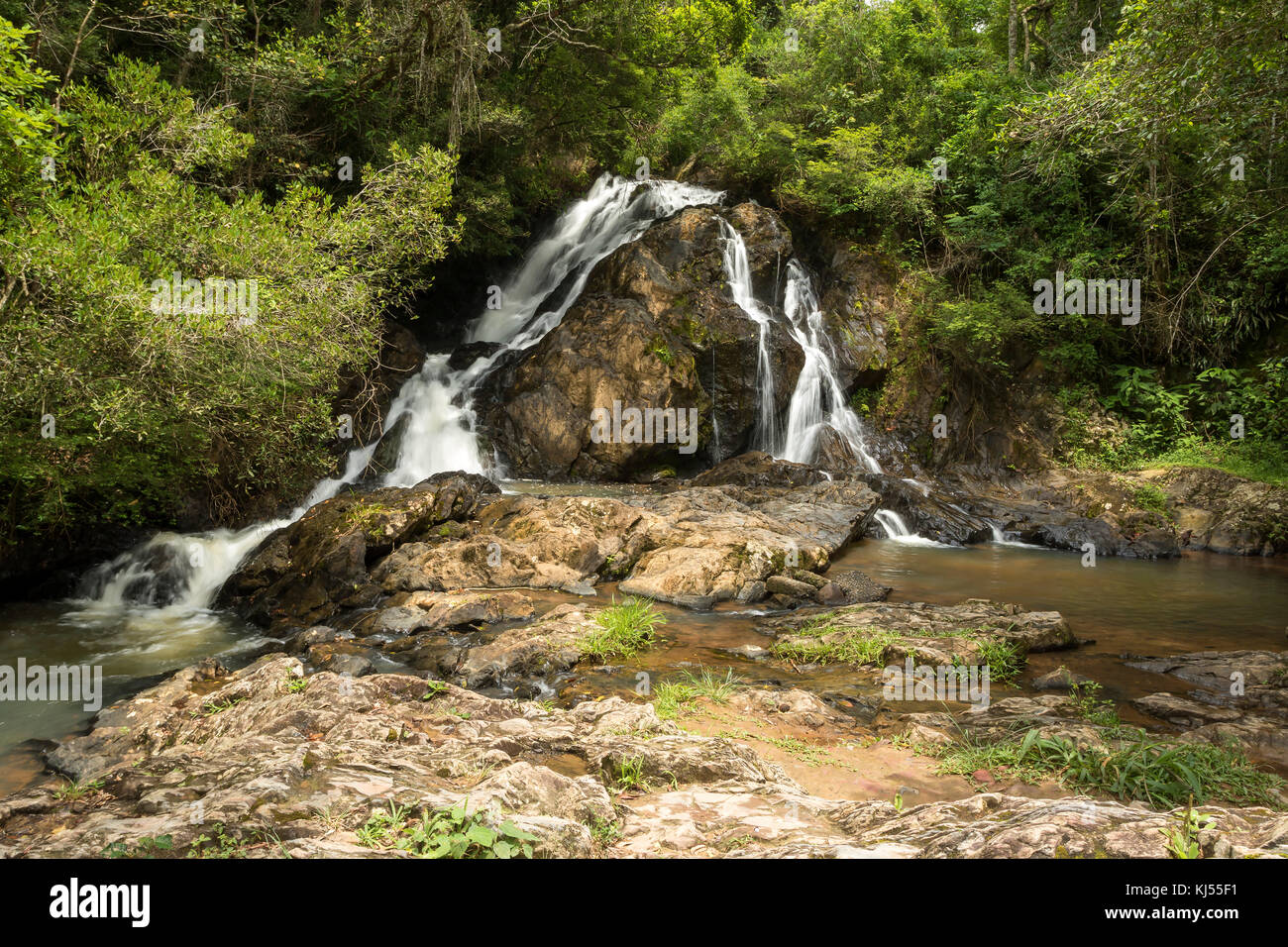 waterfall among the rocks in the forest Stock Photo - Alamy
