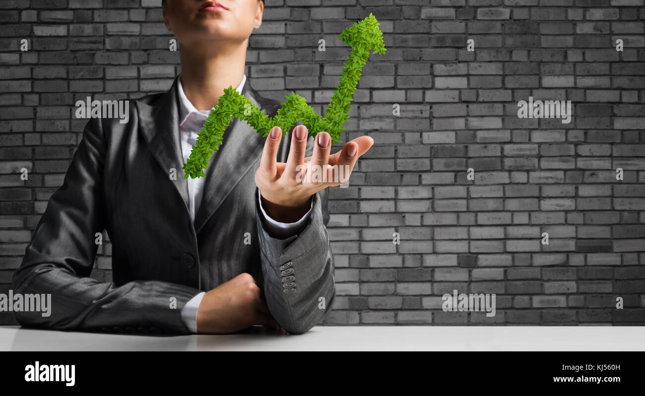 Businessman presenting growing graph Stock Photo - Alamy
