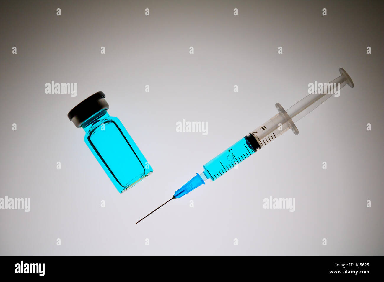 Medical syringe with blue medicine liquid Stock Photo Alamy
