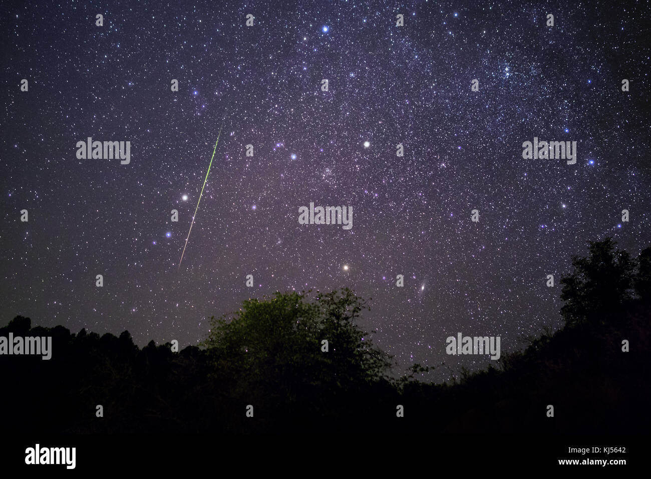 Meteor shower and starry night sky over Payson, Arizona Stock Photo