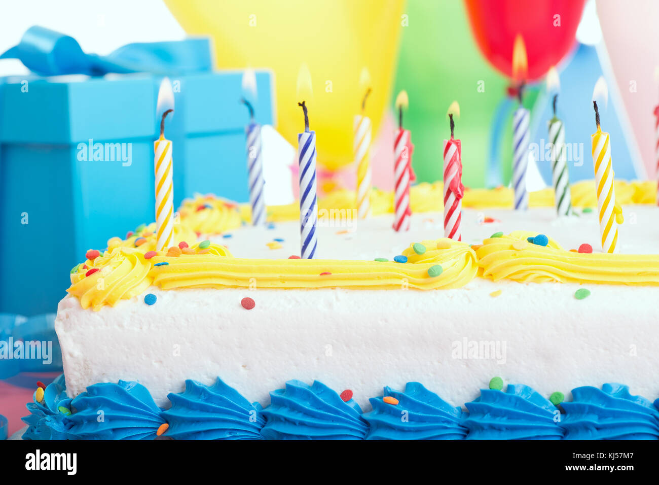Closeup of a birthday cake with burning candles Stock Photo - Alamy