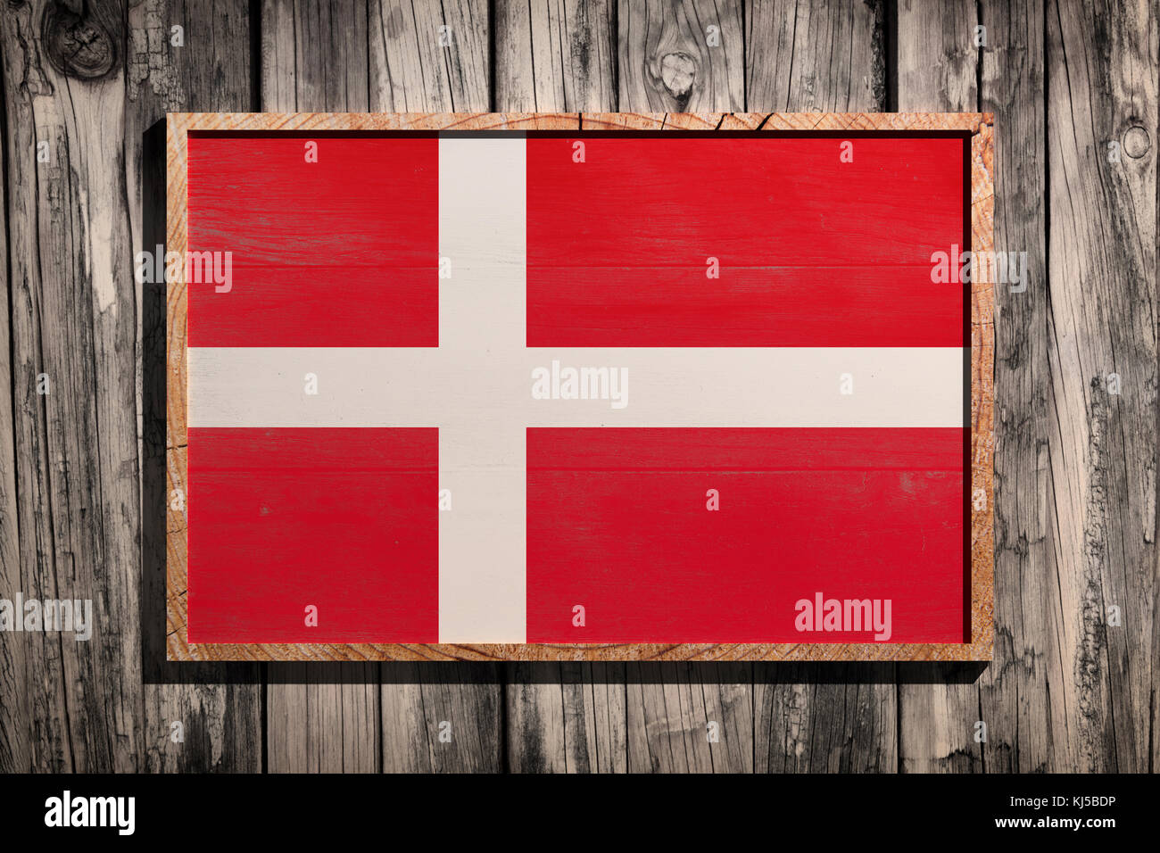 3d rendering of Denmark flag on a wooden frame over a planks wall Stock ...