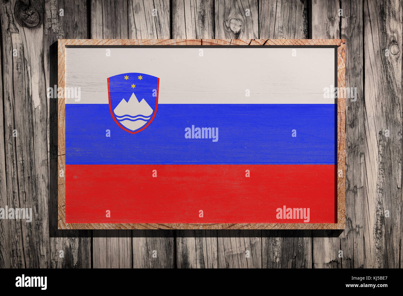 3d rendering of Slovenia flag on a wooden frame over a planks wall ...