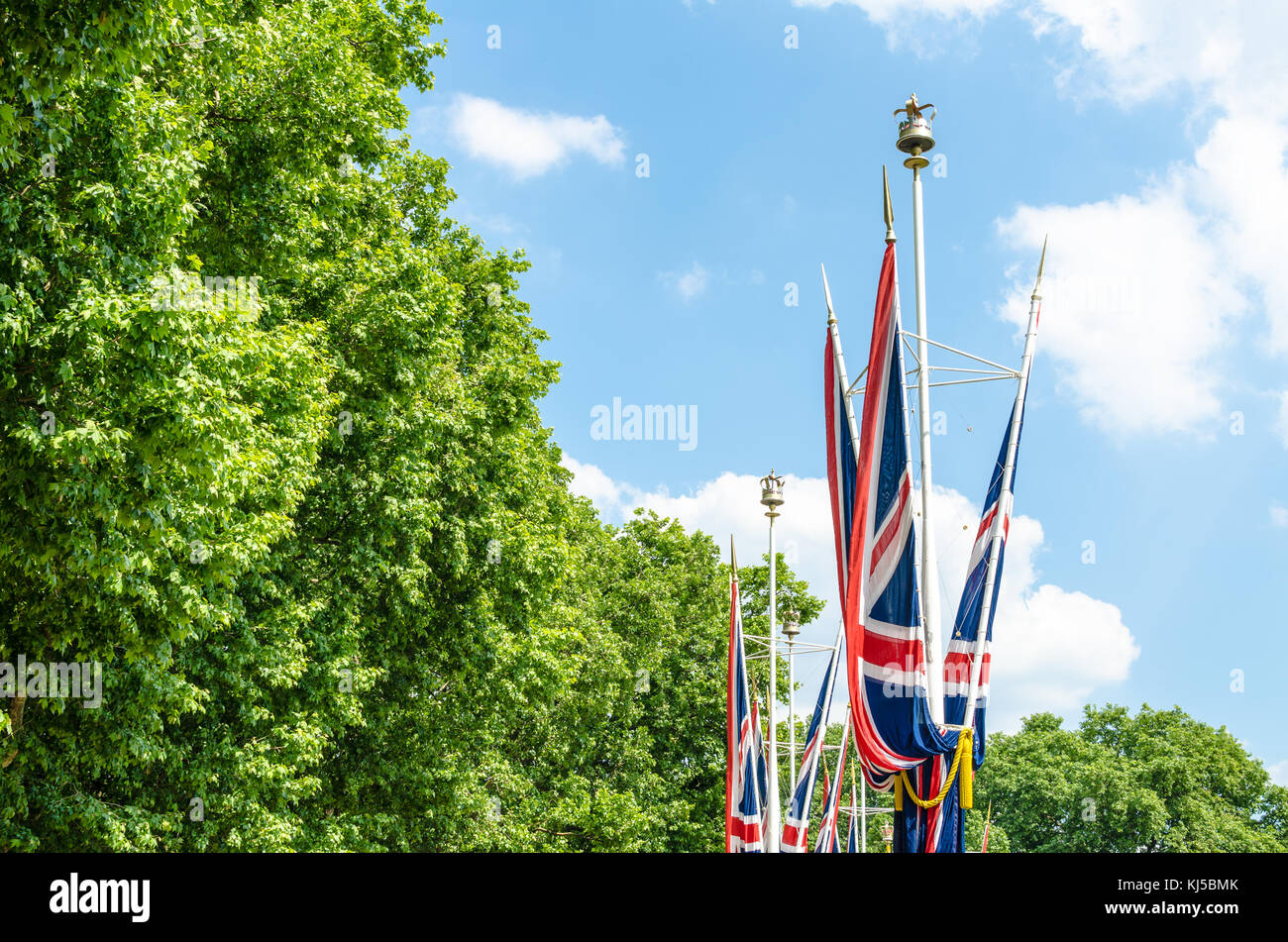 The Union Jack against the trees in summer Stock Photo