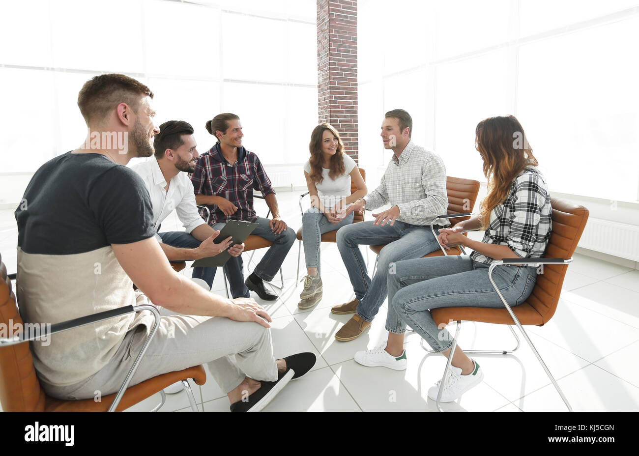 creative team sitting in the lobby of the office Stock Photo - Alamy