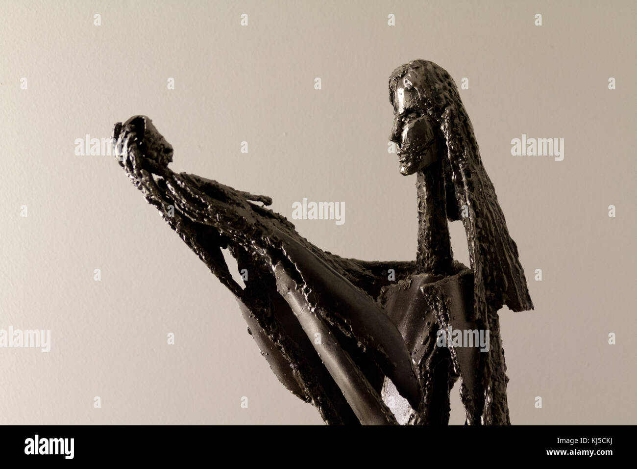 A modern metal statue of the Virgin Mary with baby Jesus in the Catholic Chapel at the Brussels Zaventem Airport. Stock Photo