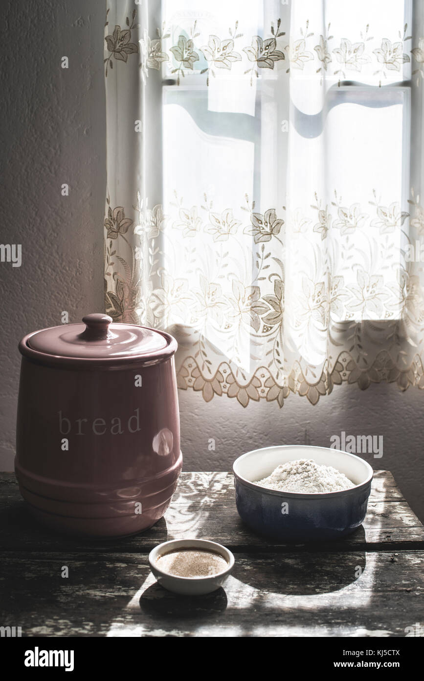 Dishes with flour and yeast in vintage room Stock Photo - Alamy