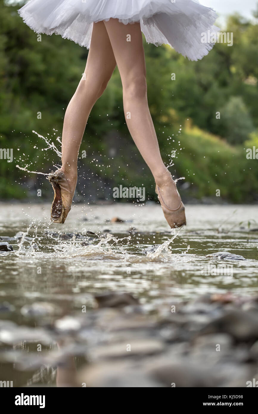 Girl jumping in river hi-res stock photography and images - Alamy