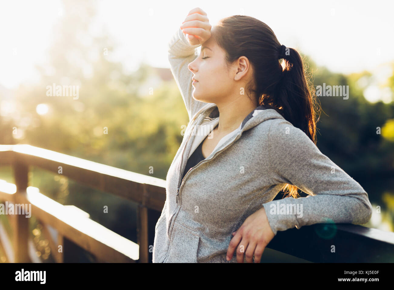 Beautiful female tired after jogging Stock Photo Alamy