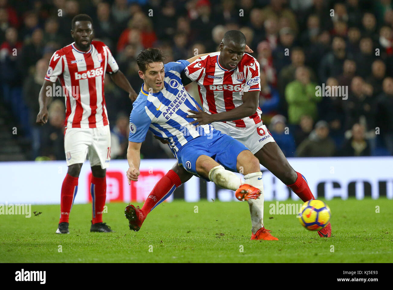 Kurt Zouma tackles Lewis Dunk of Brighton during the Premier League match between Brighton and Hove Albion and Stoke City at the American Express Community Stadium in Brighton and Hove. 20 Nov 2017. **** EDITORIAL USE ONLY ***  FA Premier League and Football League images are subject to DataCo Licence see www.football-dataco.com Stock Photo