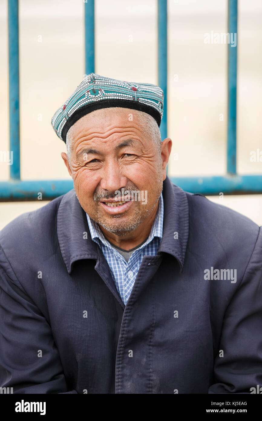 Keriya,China - October 04,2017: Uyghur elder sells his merchandise in ...