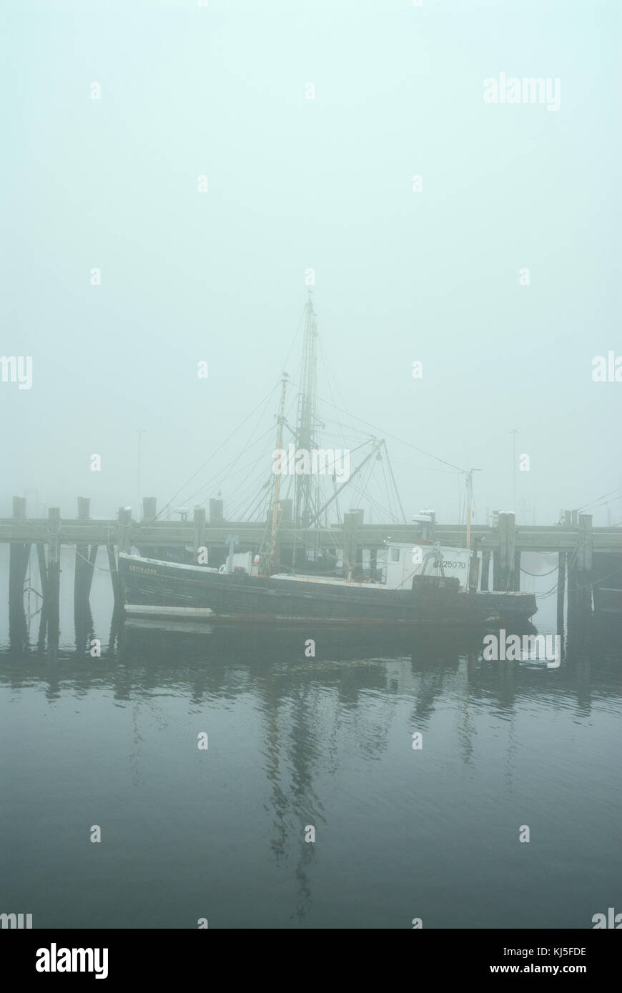 Fishing boat in heavy mist, Provincetown, Massachusetts, USA. Stock Photo