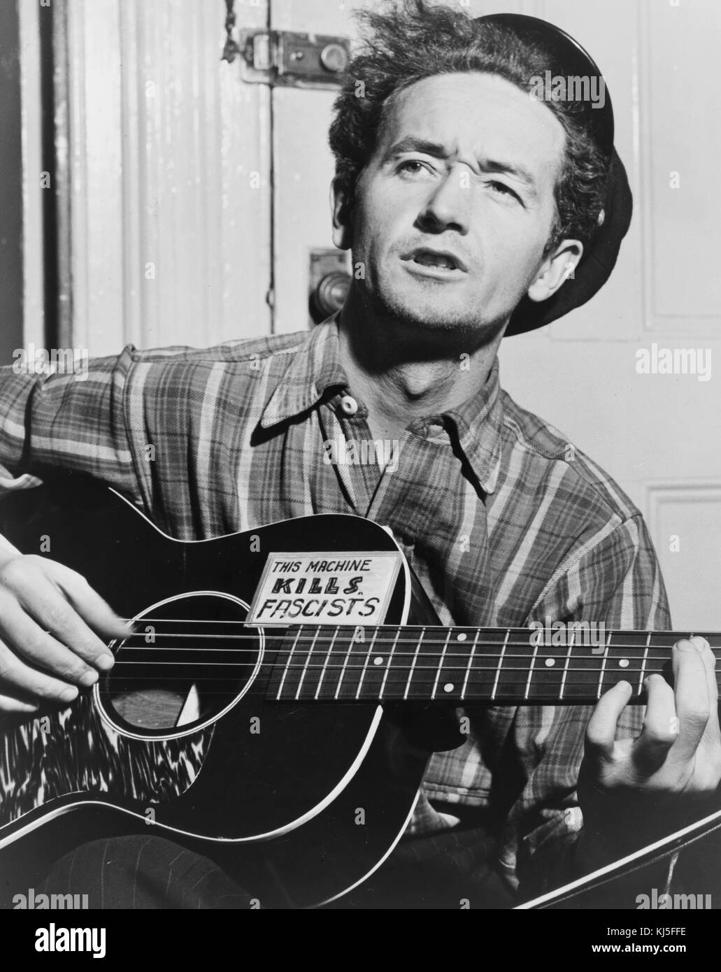 Woodrow Wilson 'Woody' Guthrie (1912 – 1967) American singer-songwriter and musician whose musical legacy includes hundreds of political, traditional, and children's songs, along with ballads and improvised works. Stock Photo
