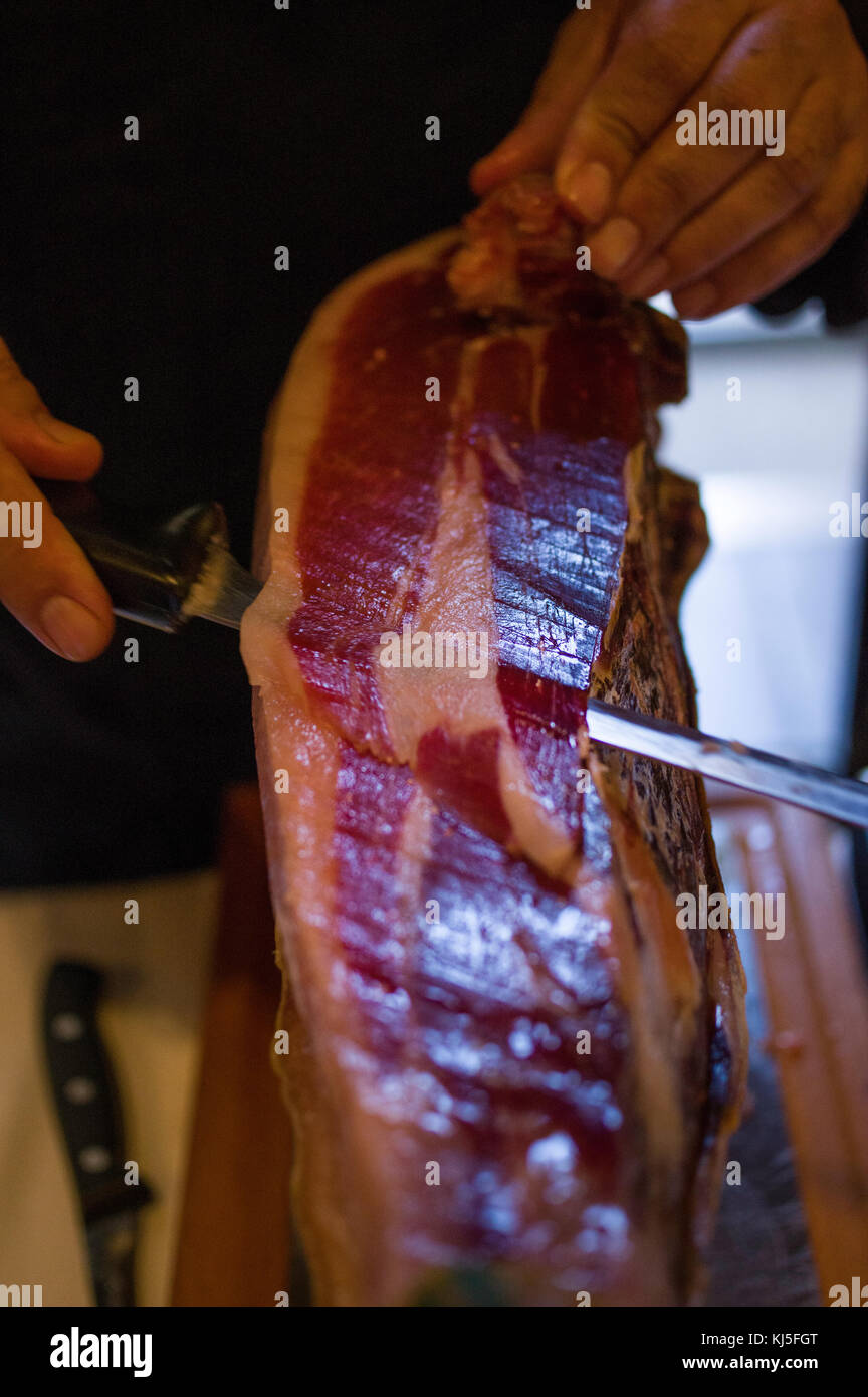 Carving Iberian ham at Restaurant El Monte, Salamanca, Spain Stock Photo
