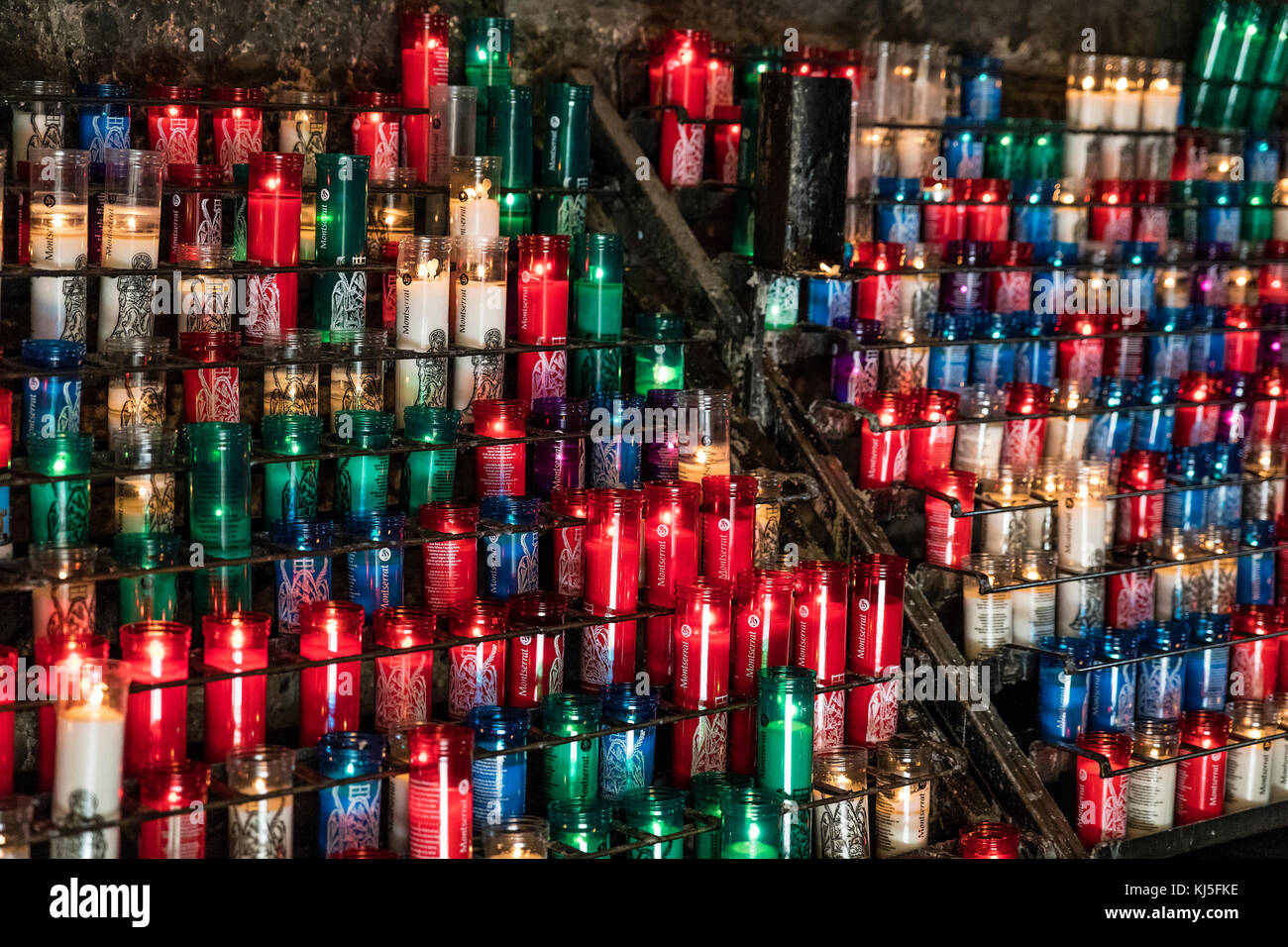 Votive candles in Santa Maria de Montserrat Abbey, Monistrol de Montserrat,  Catalonia, Spain Stock Photo