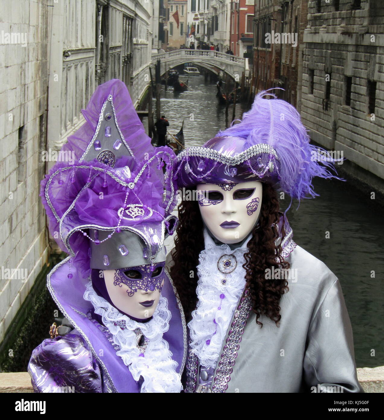 Costumed attendees at the Venice Carnival (Carnevale di Venezia), an annual festival held in Venice, Italy. Started to recall a victory of the 'Serenissima Repubblica' against the Patriarch of Aquileia, in the year 1162. In the honour of this victory, the people started to dance and gather in San Marco Square. Stock Photo