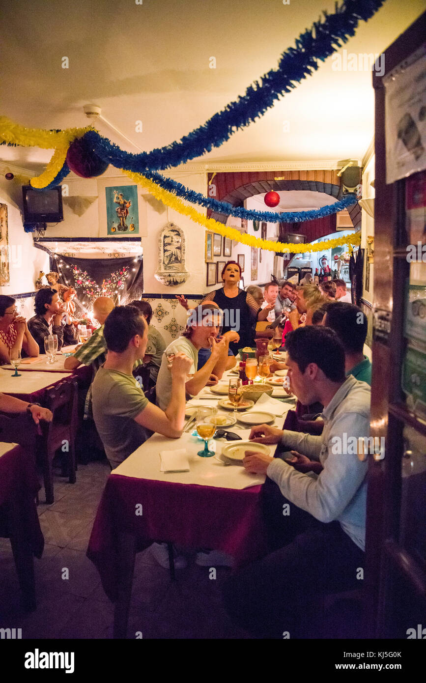 Fado and food with friends in the Alfama District, Lisbon, Portugal Stock Photo