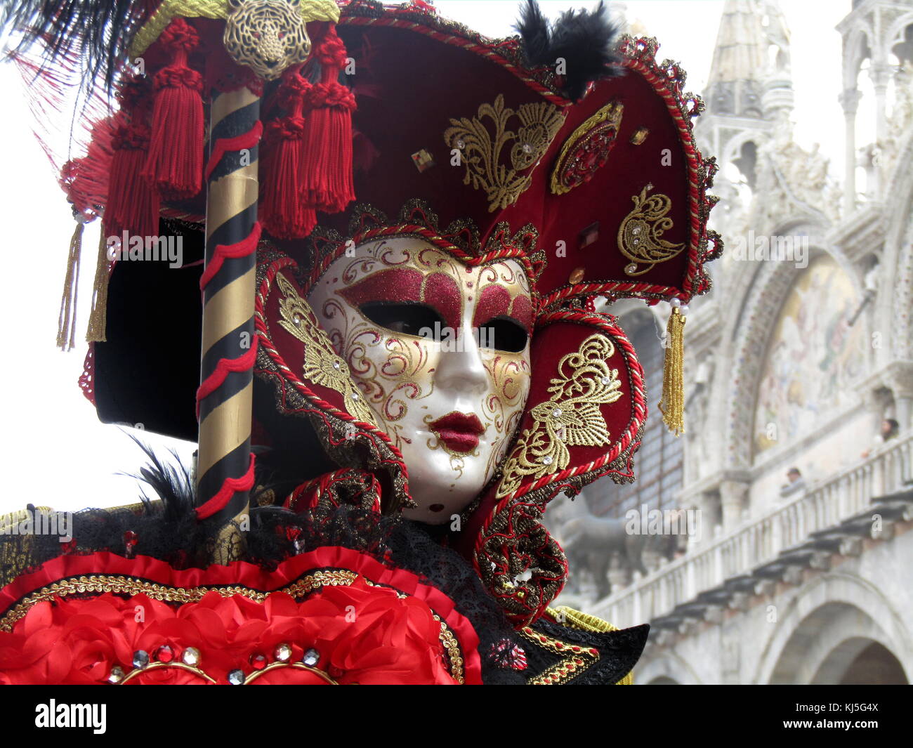 Costumed attendee at the Venice Carnival (Carnevale di Venezia), an annual festival held in Venice, Italy. Started to recall a victory of the 'Serenissima Repubblica' against the Patriarch of Aquileia, in the year 1162. In the honour of this victory, the people started to dance and gather in San Marco Square. Stock Photo